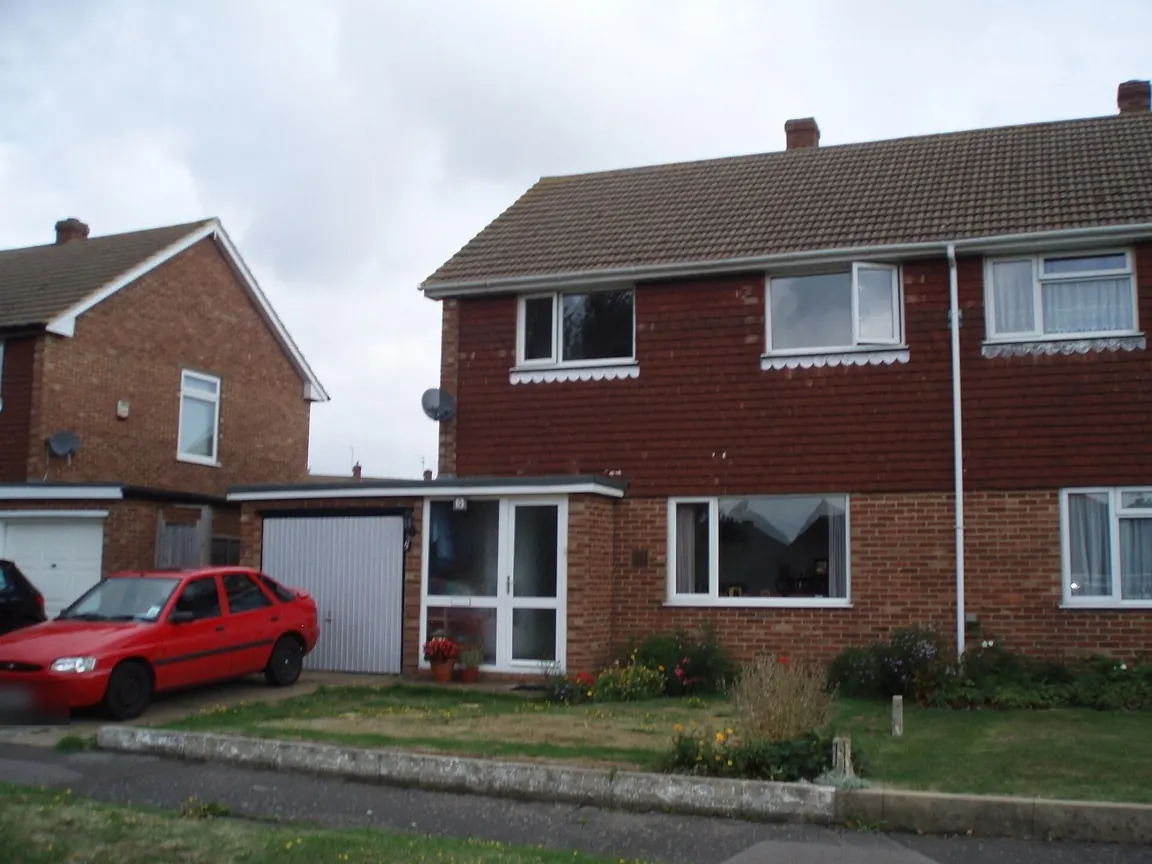 Semi-detached house with old fascias and gutters